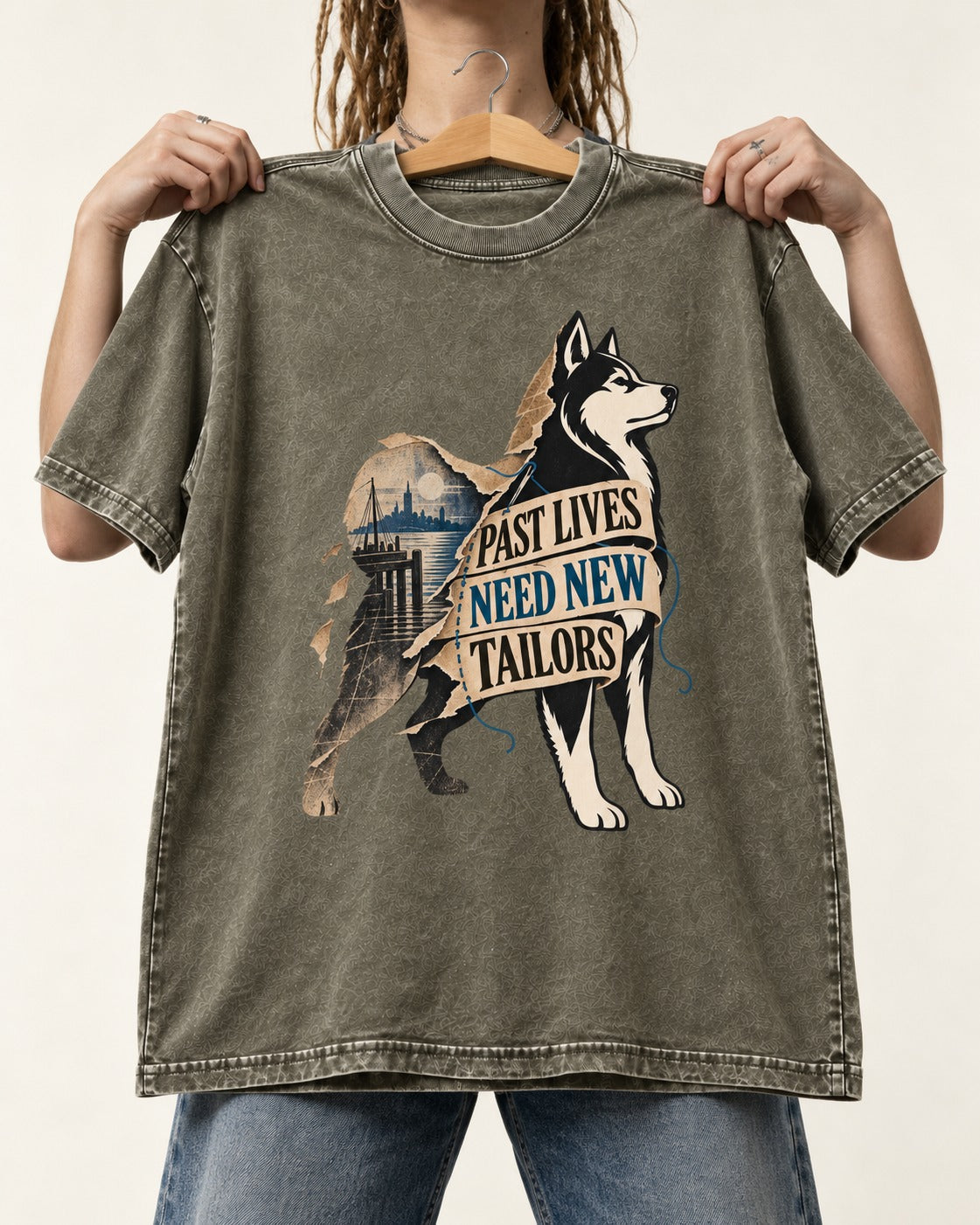 Husky Past Lives Need New Tailors Split Identity Graphic Washed Tee in Army Green, held up on a hanger