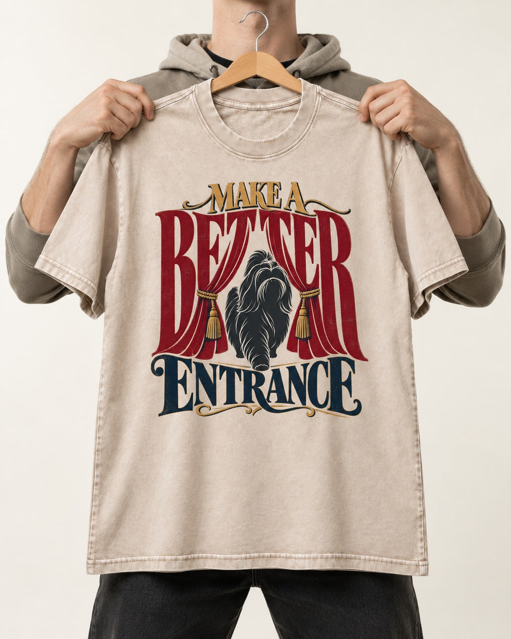 A Better Shih Tzu Entrance Washed Tee in Apricot, held up on a hanger