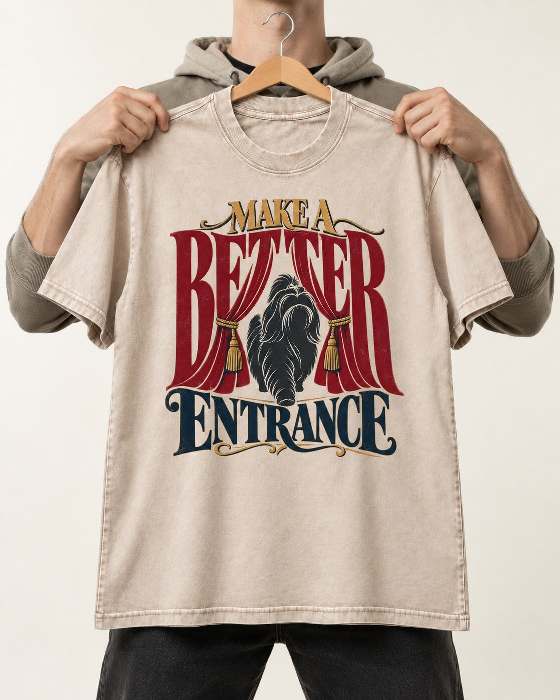 A Better Shih Tzu Entrance Washed Tee in Apricot, held up on a hanger