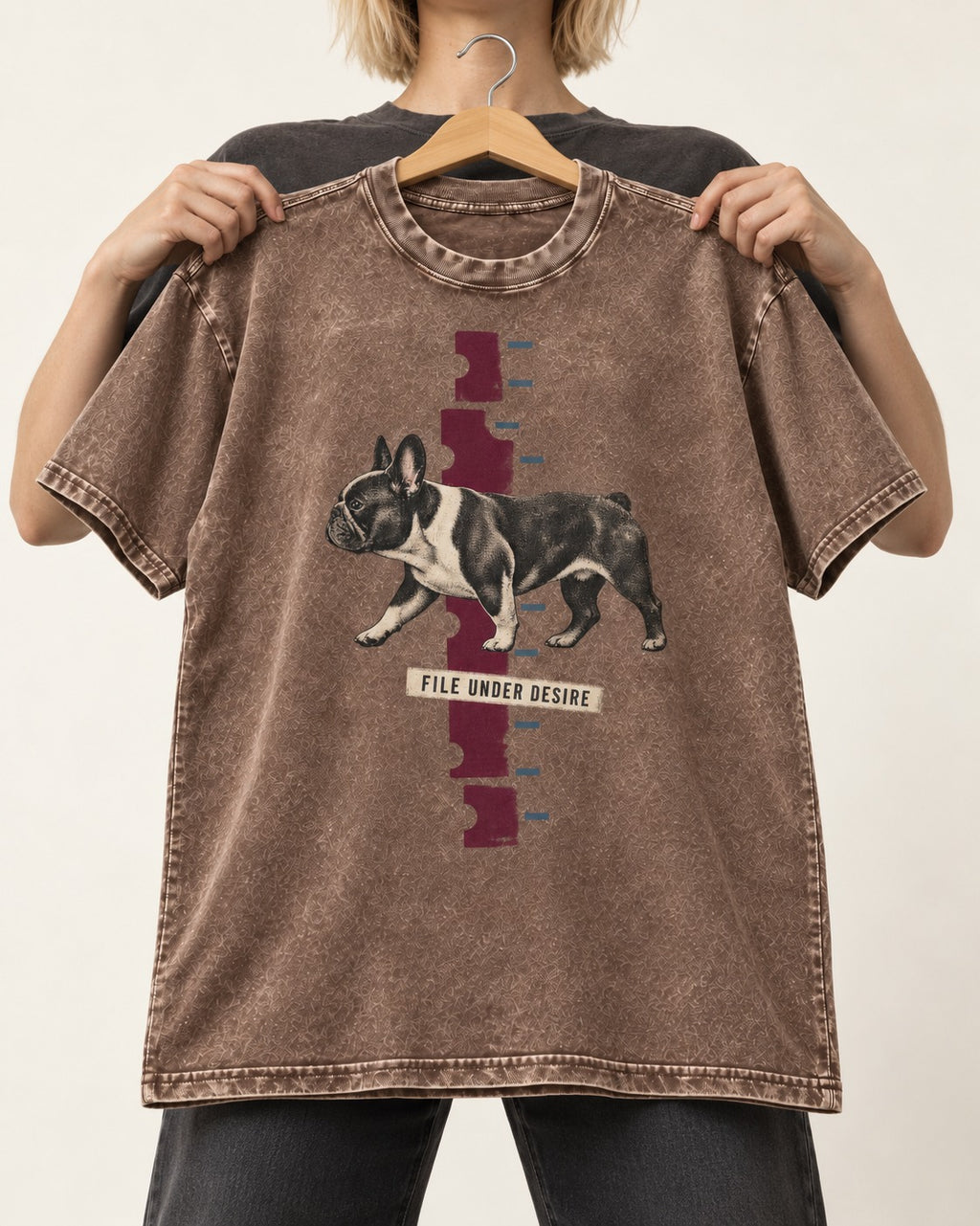 File Under Frenchie Desire Washed Tee in Coffee, held up on a hanger