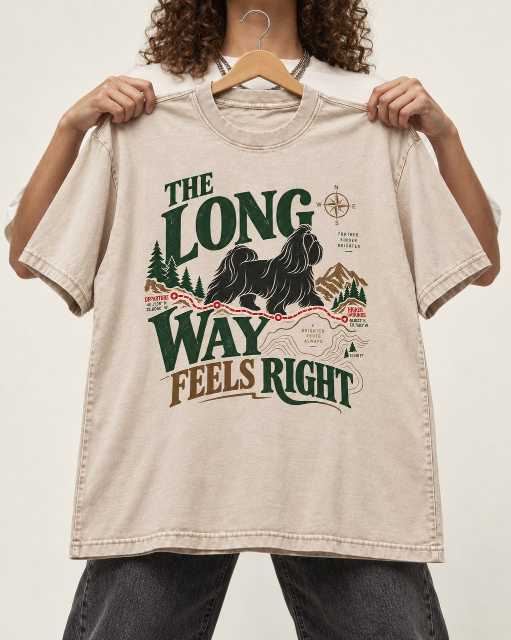 Shih Tzu Takes the Long Way Washed Tee in Apricot, held up on a hanger
