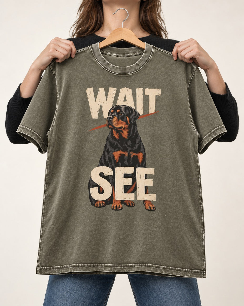 Wait See Rottweiler Seated Slash Graphic Washed Tee in Army Green, held up on a hanger