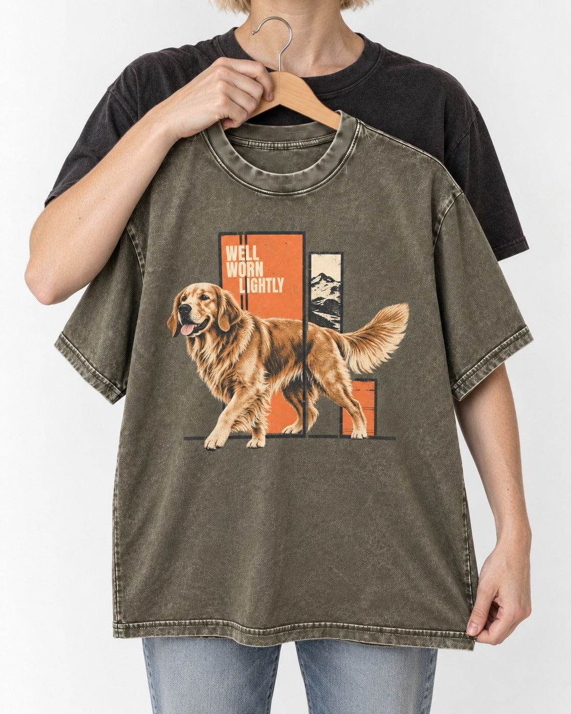 Golden Retriever Well Worn Lightly Mountain Graphic Washed Tee in Army Green, held up on a hanger