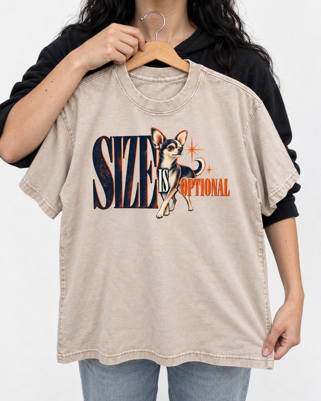 Chihuahua Size Is Optional Starburst Graphic Washed Tee in Apricot, held up on a hanger