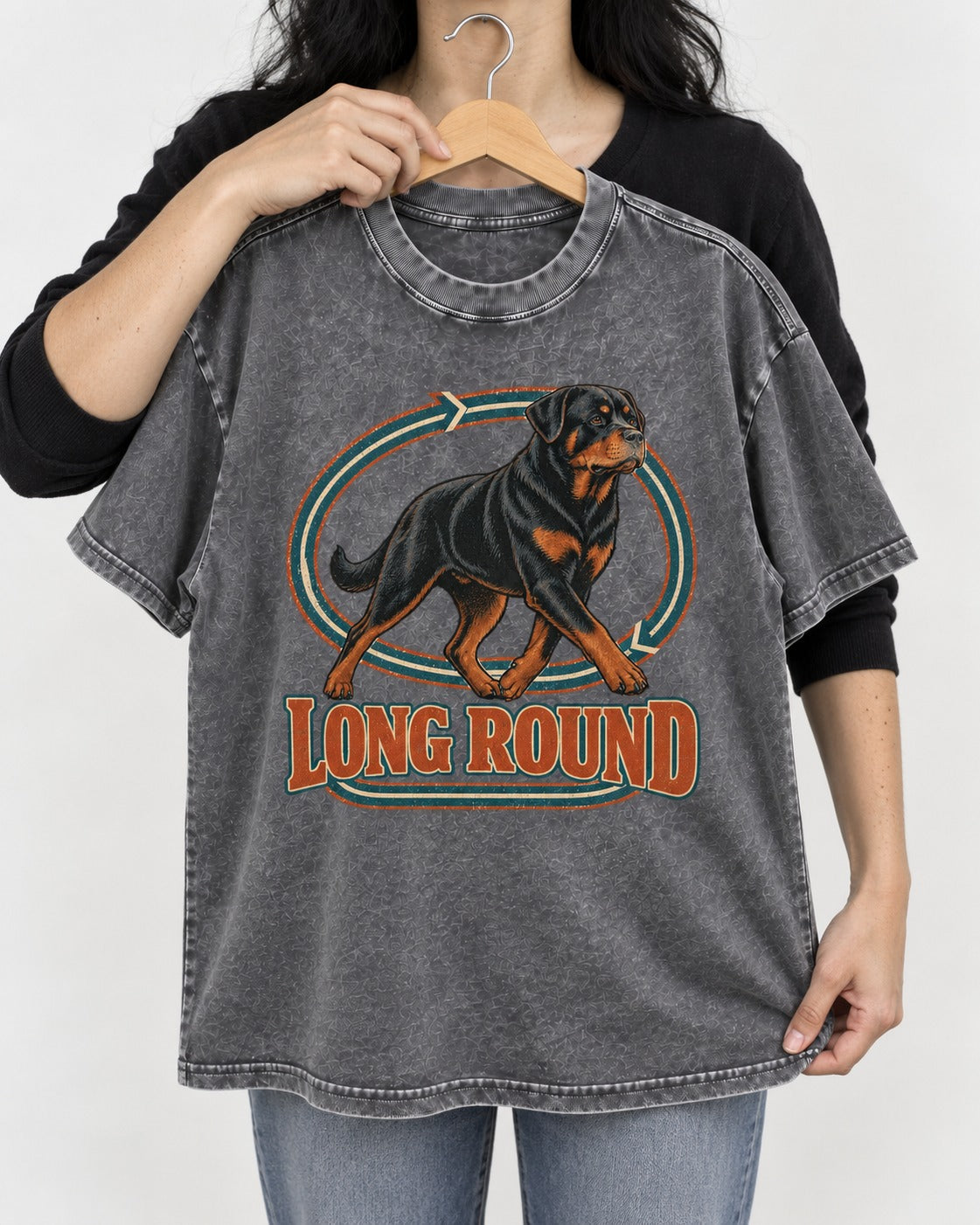 Rottweiler Long Round Circular Track Graphic Washed Tee in Gray, held up on a hanger