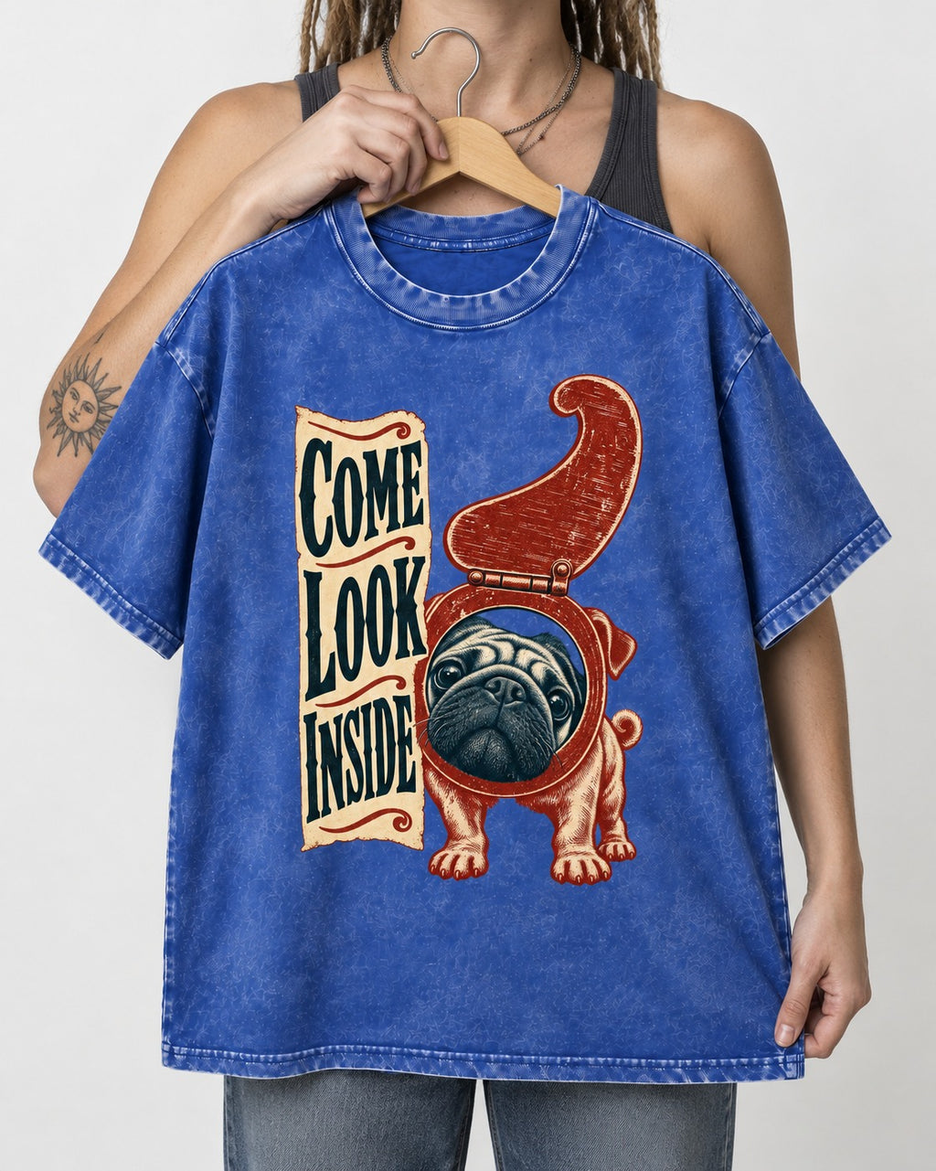 Pug Come Look Inside Toilet Seat Graphic Washed Tee in Royal Blue, held up on a hanger