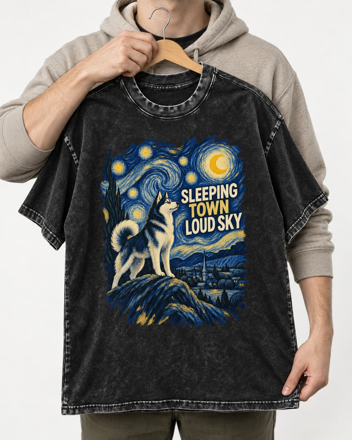 Husky Sleeping Town Loud Sky Starry Night Graphic Washed Tee in Black, held up on a hanger