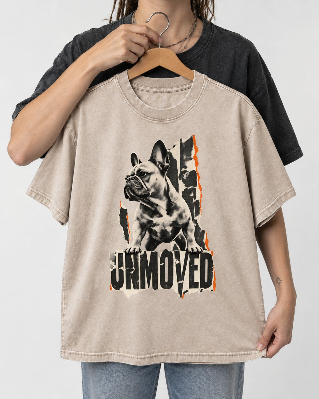 Frenchie Unmoved Torn Poster Graphic Washed Tee in Apricot, held up on a hanger