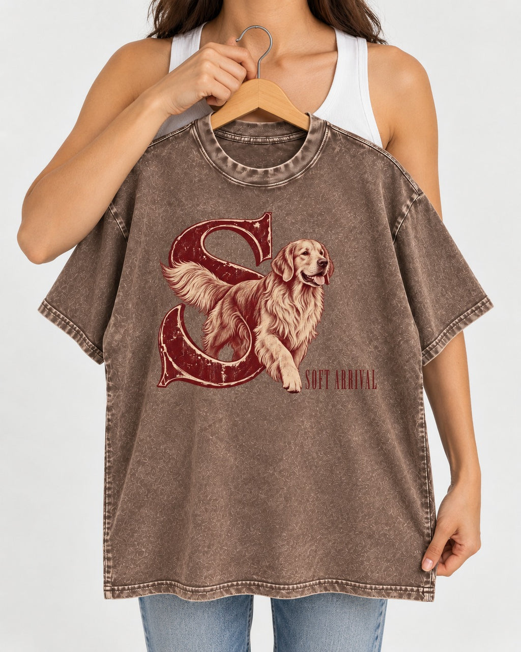 Soft Arrival Golden Retriever Washed Tee in Coffee, held up on a hanger