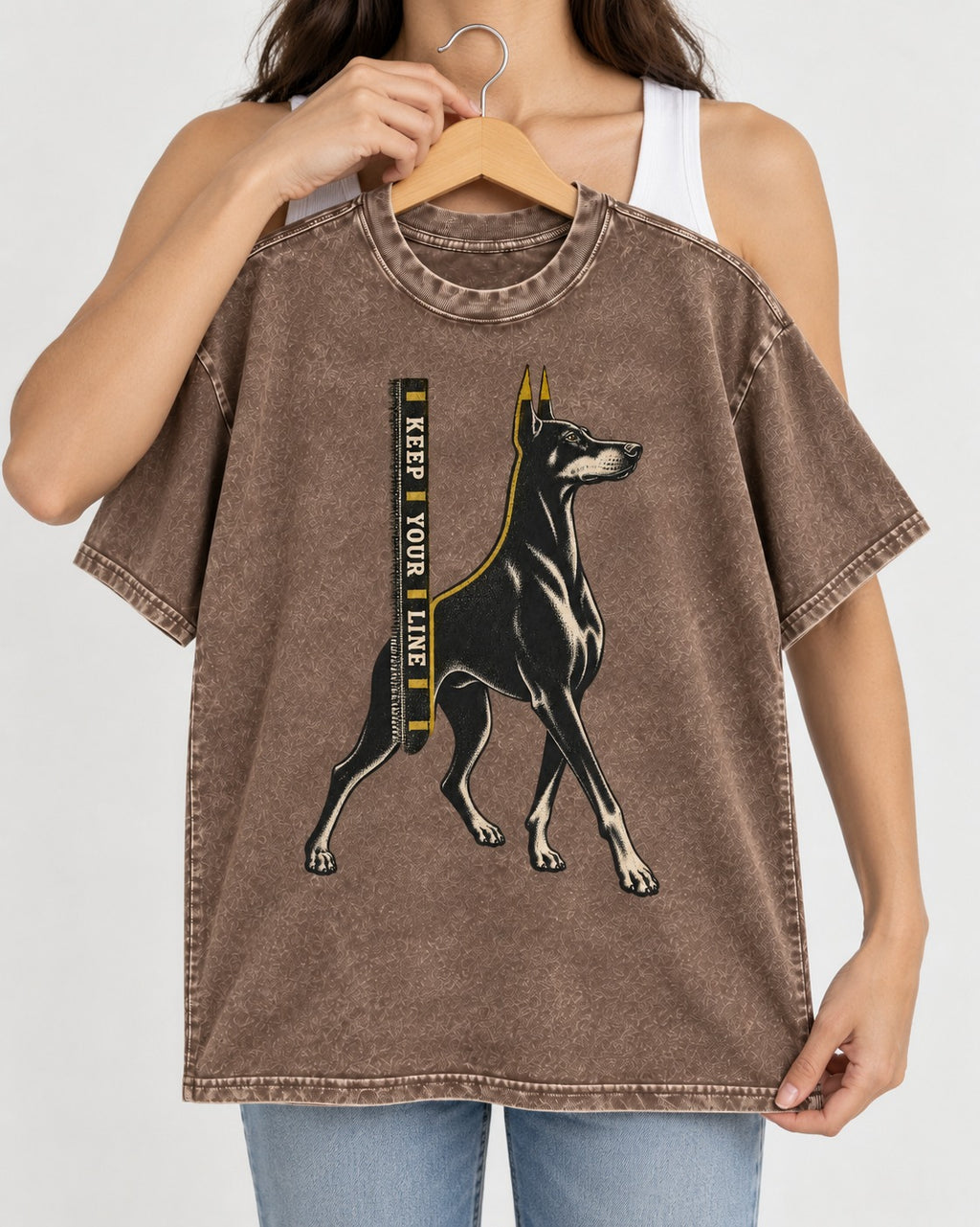 Keep Your Line Doberman Washed Tee in Coffee, held up on a hanger
