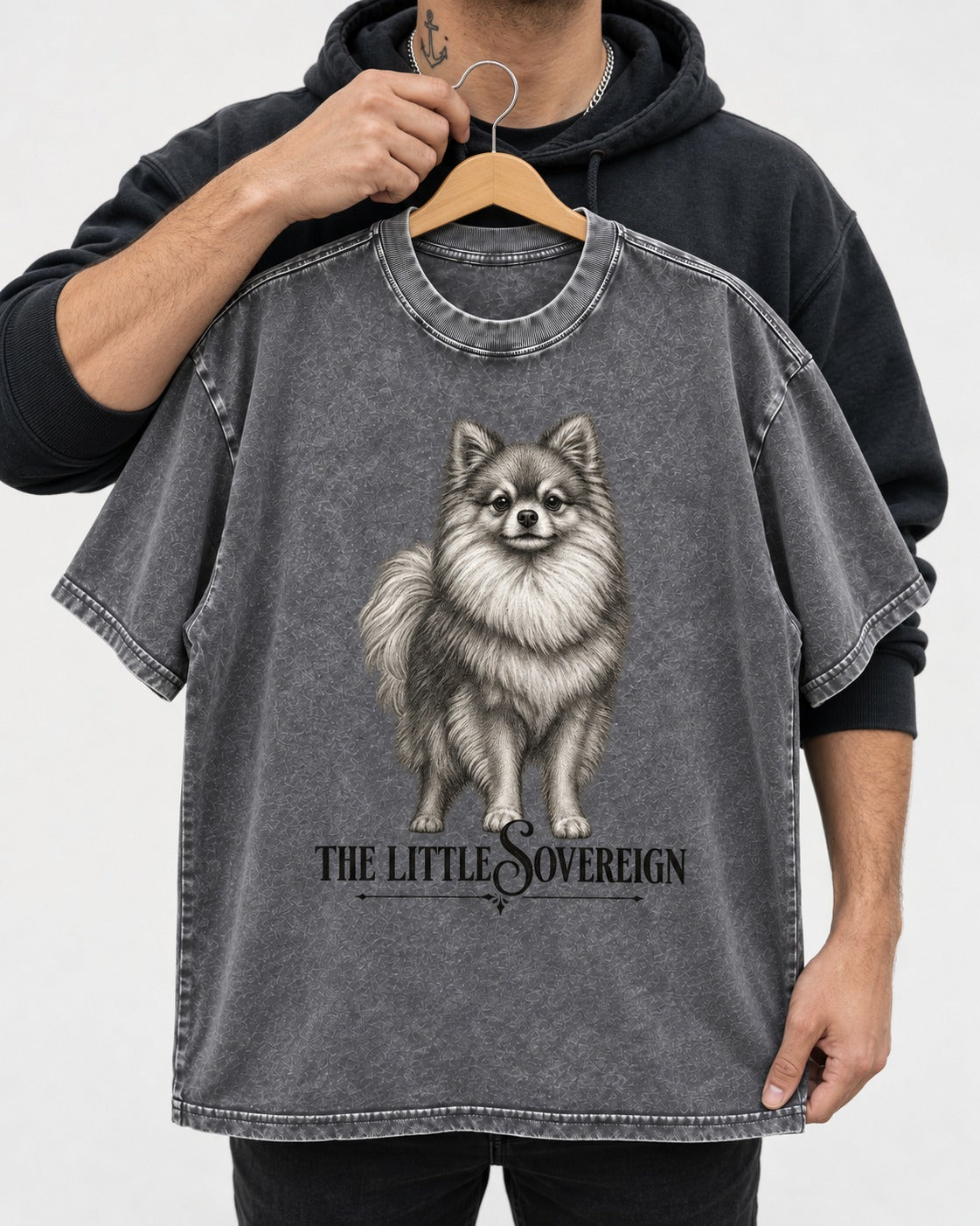 The Little Sovereign Pomeranian Washed Tee in Gray, held up on a hanger