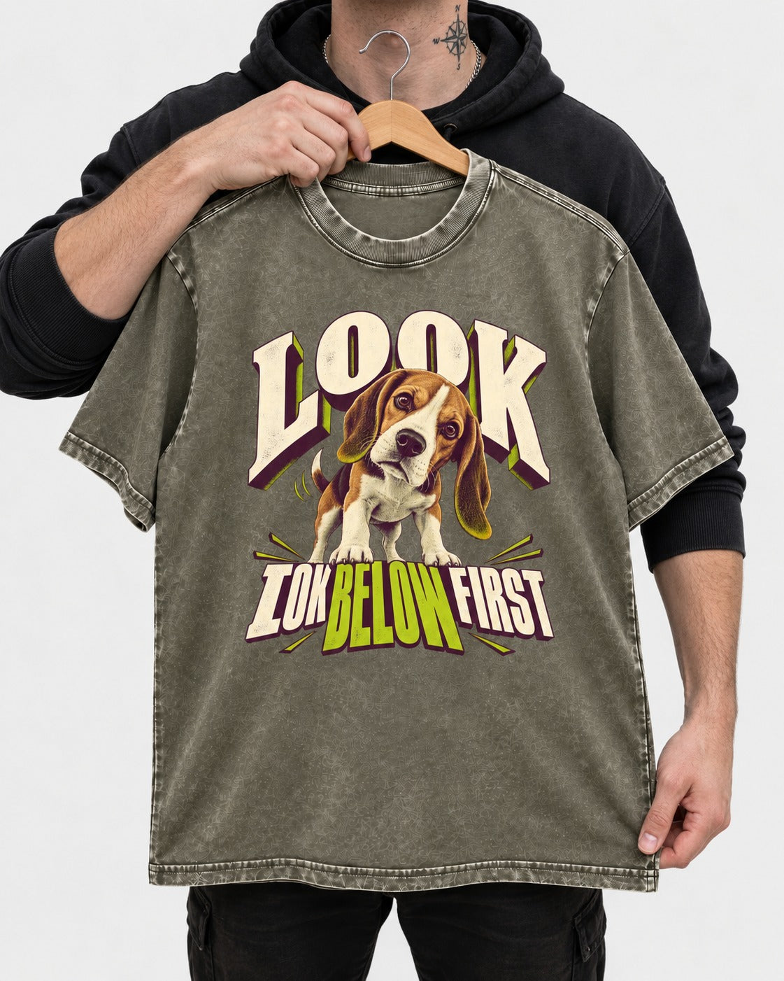 Beagle Look Low Below First Washed Tee in Army Green, held up on a hanger