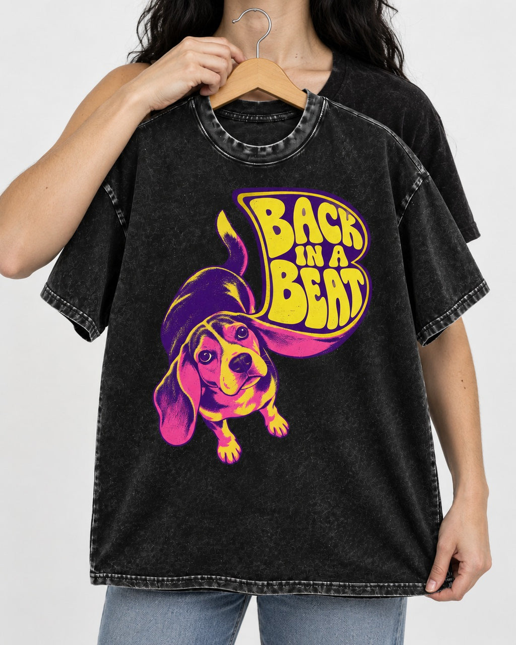 Groovy Beagle Back In A Beat Washed Tee in Black, held up on a hanger
