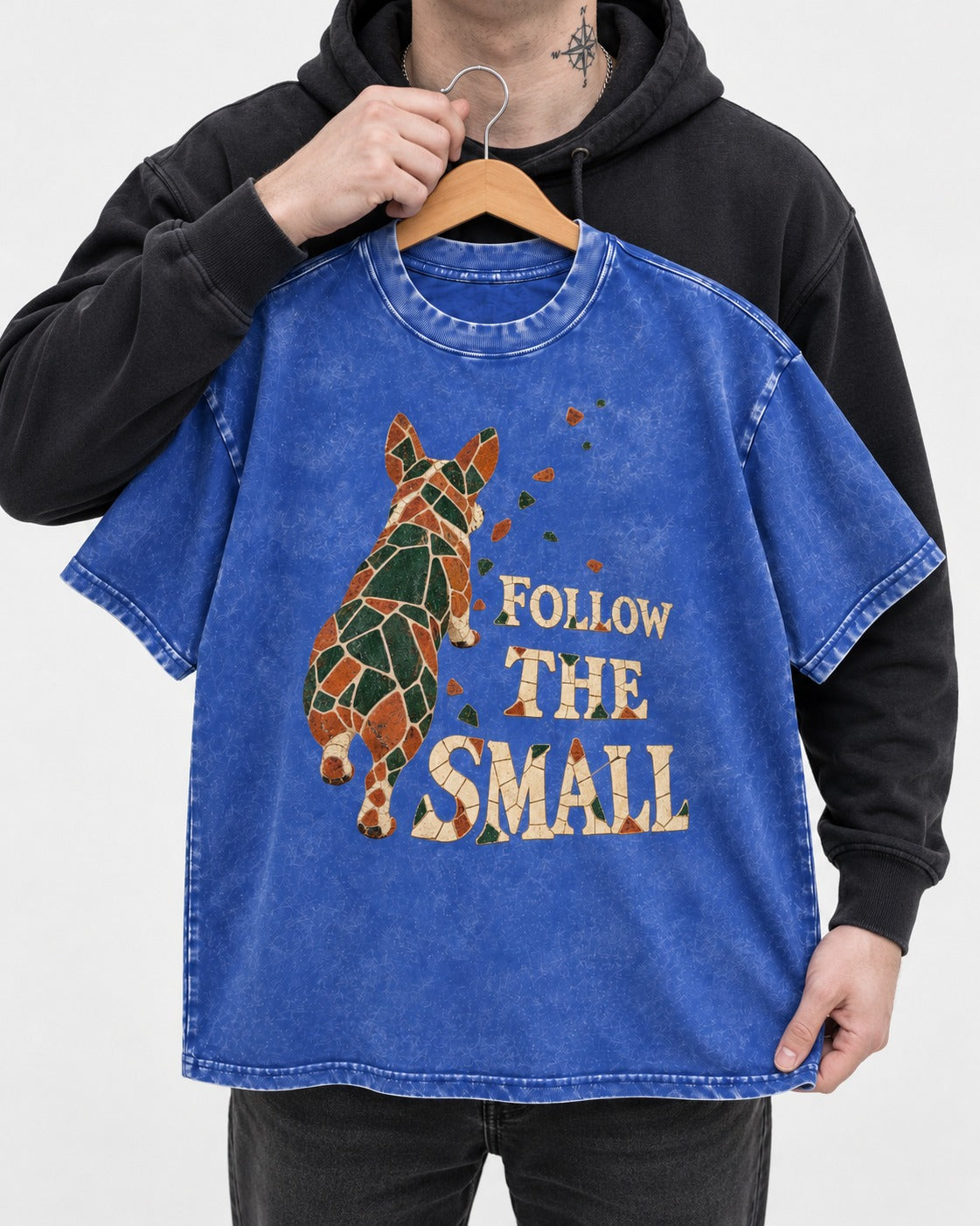 Corgi Follow the Small Mosaic Washed Tee in Royal Blue, held up on a hanger