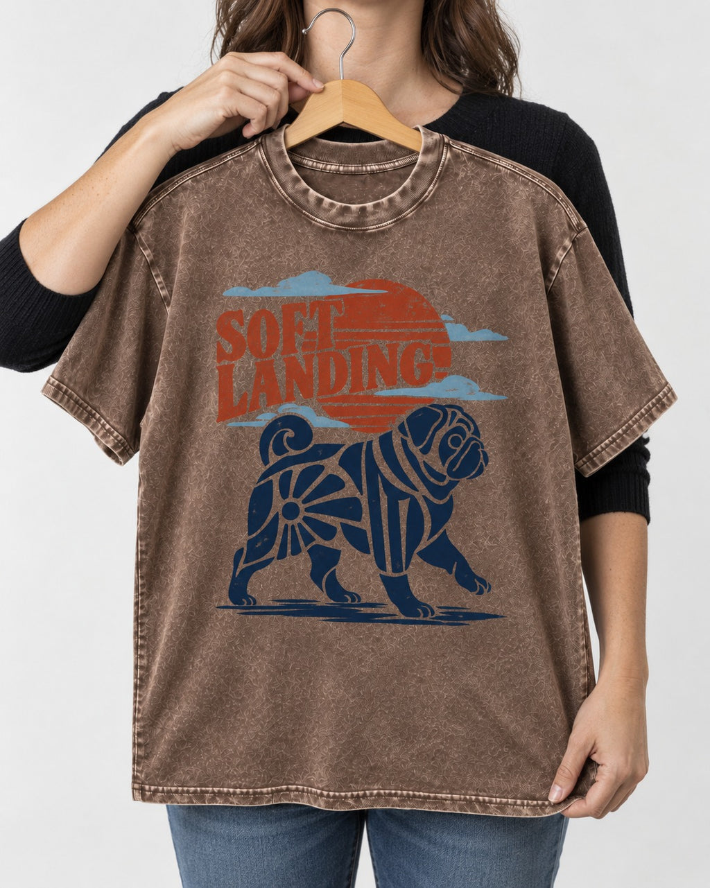 Pug's Soft Landing Washed Tee in Coffee, held up on a hanger