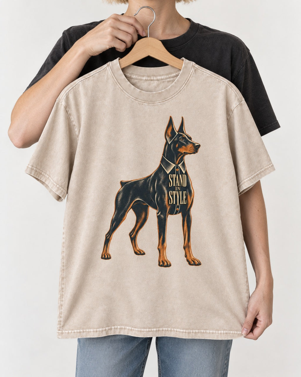 Doberman Stand in Style Suit Graphic Washed Tee in Apricot, held up on a hanger