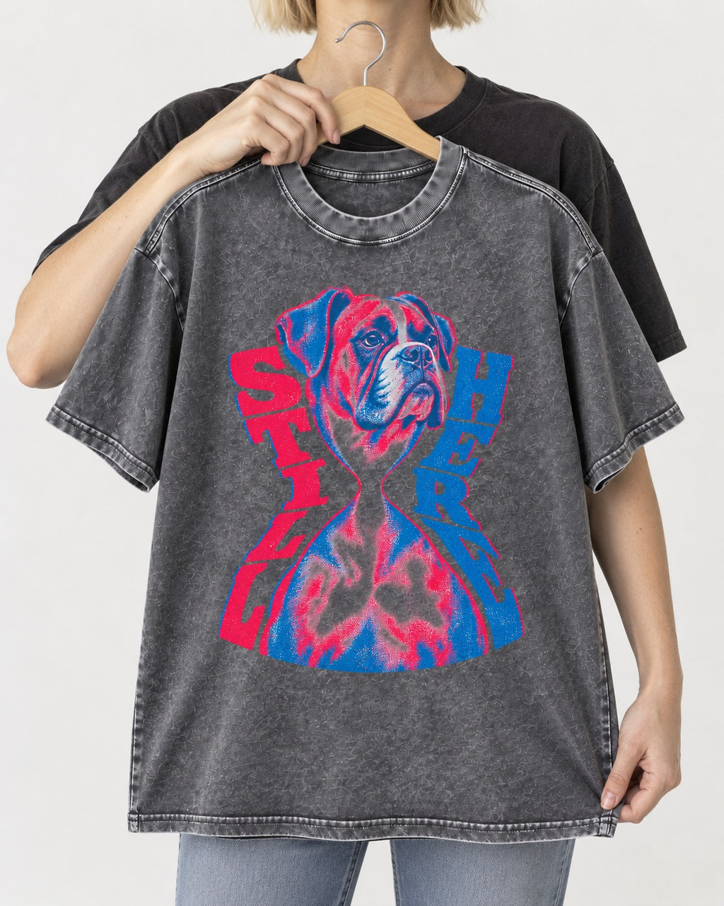 Stay Here Boxer Duotone Portrait Washed Tee in Gray, held up on a hanger