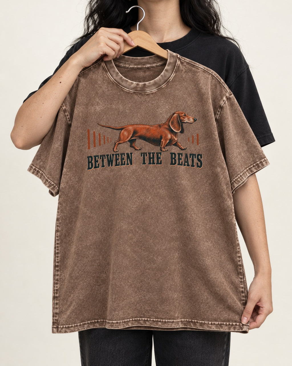 Dachshund Between the Beats Washed Tee in Coffee, held up on a hanger