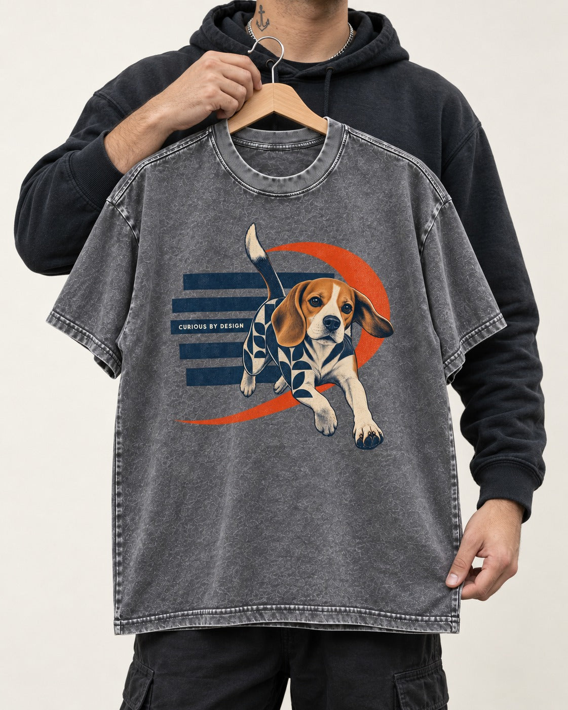 Beagle Born Curious Washed Tee in Gray, held up on a hanger