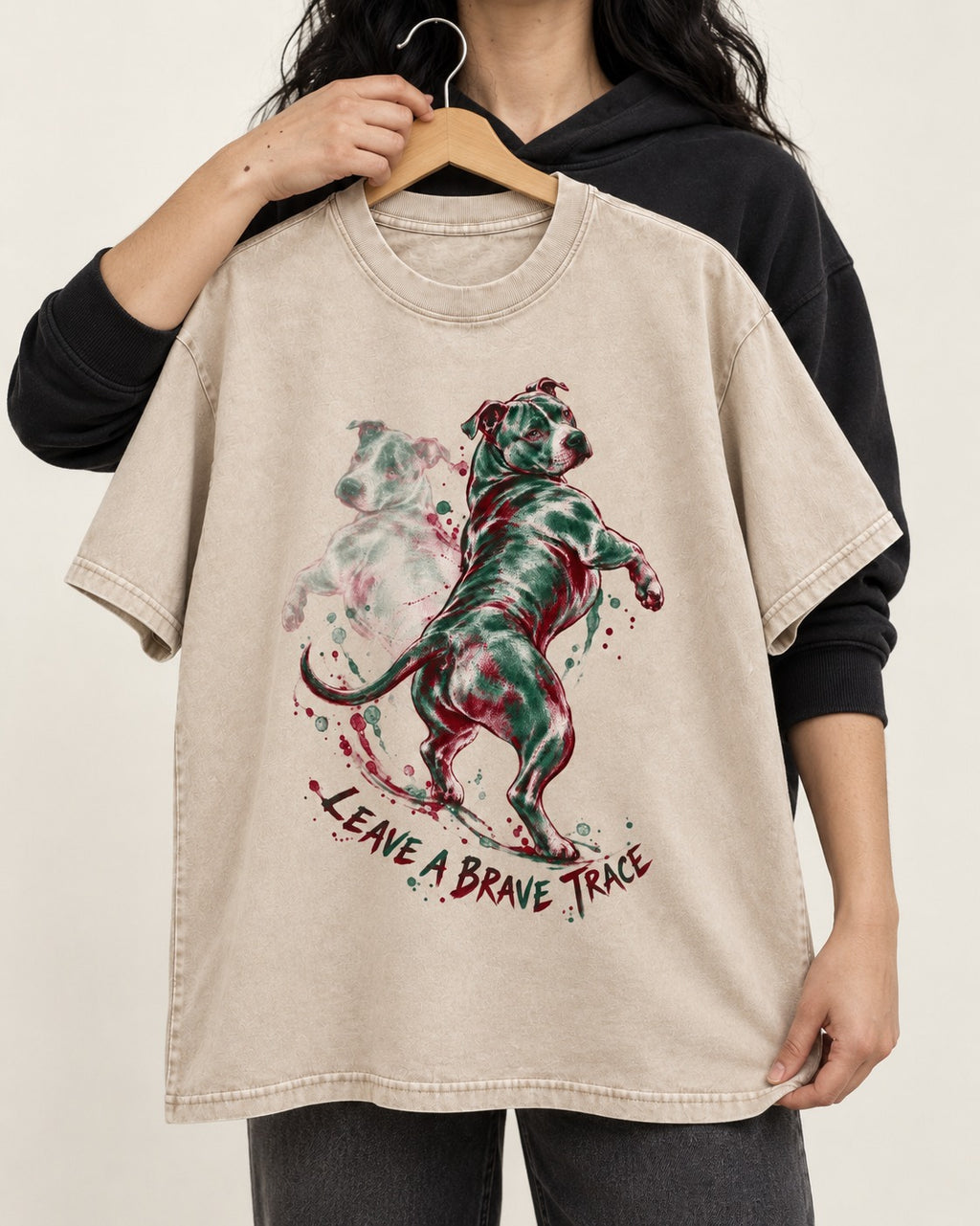 Pitbull's Brave Trace Washed Tee in Apricot, held up on a hanger