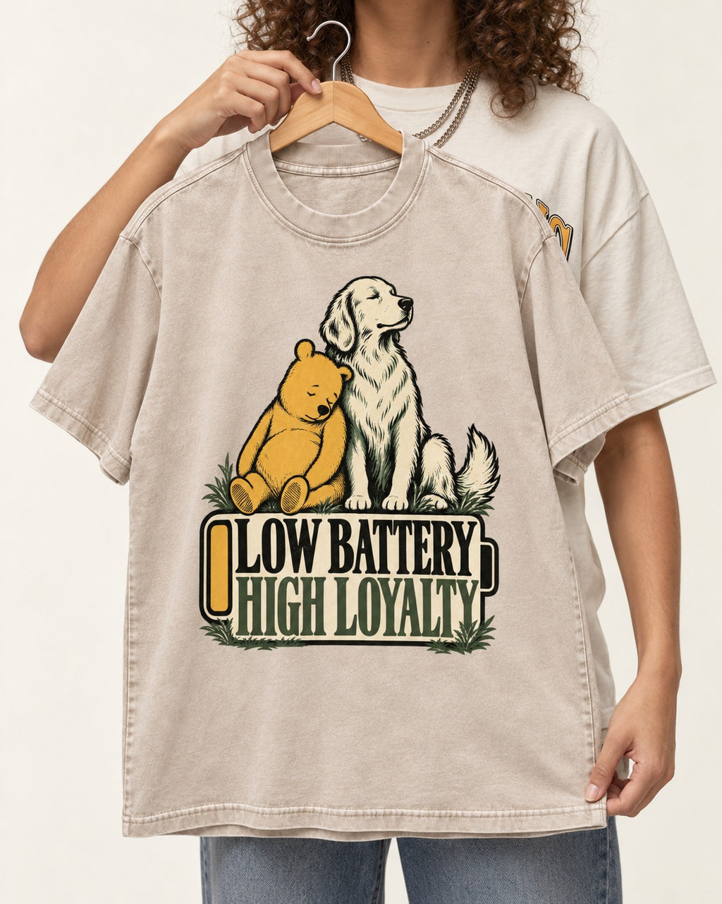 Golden Retriever Low Battery High Loyalty Washed Tee in Apricot, held up on a hanger