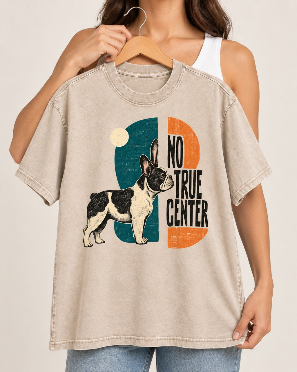 No True Center Frenchie Washed Tee in Apricot, held up on a hanger