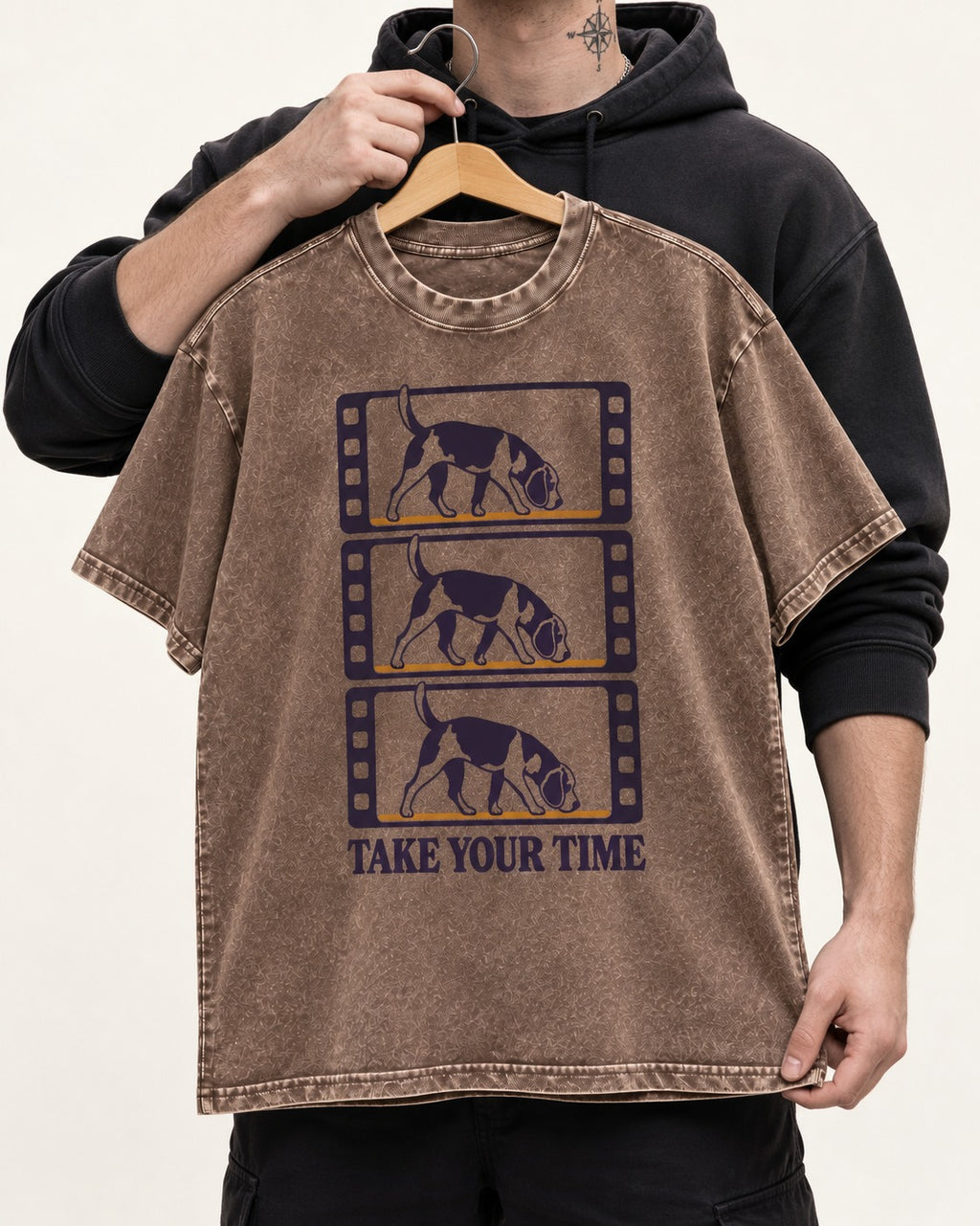 Beagle Take Your Time Washed Tee in Coffee, held up on a hanger