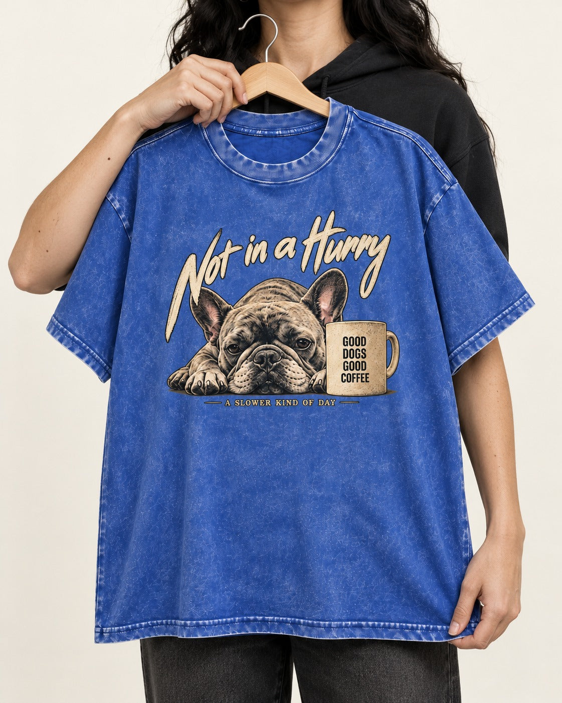 Frenchie Not in a Hurry Coffee Graphic Washed Tee in Royal Blue, held up on a hanger