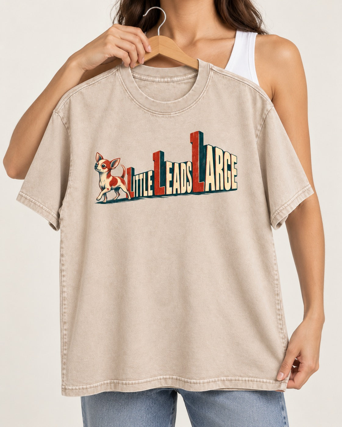 Chihuahua Little Leads Large Perspective Typography Washed Tee in Apricot, held up on a hanger
