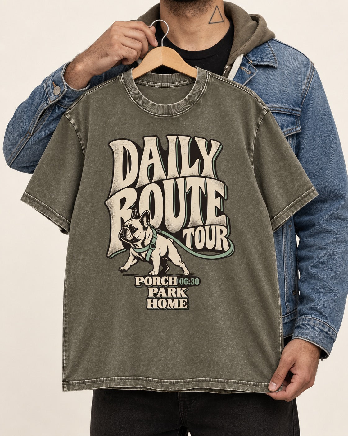Frenchie Daily Route Tour Graphic Washed Tee in Army Green, held up on a hanger