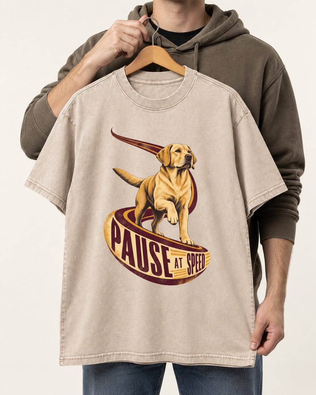 Labrador Retriever Pause at Speed Ribbon Graphic Washed Tee in Apricot, held up on a hanger