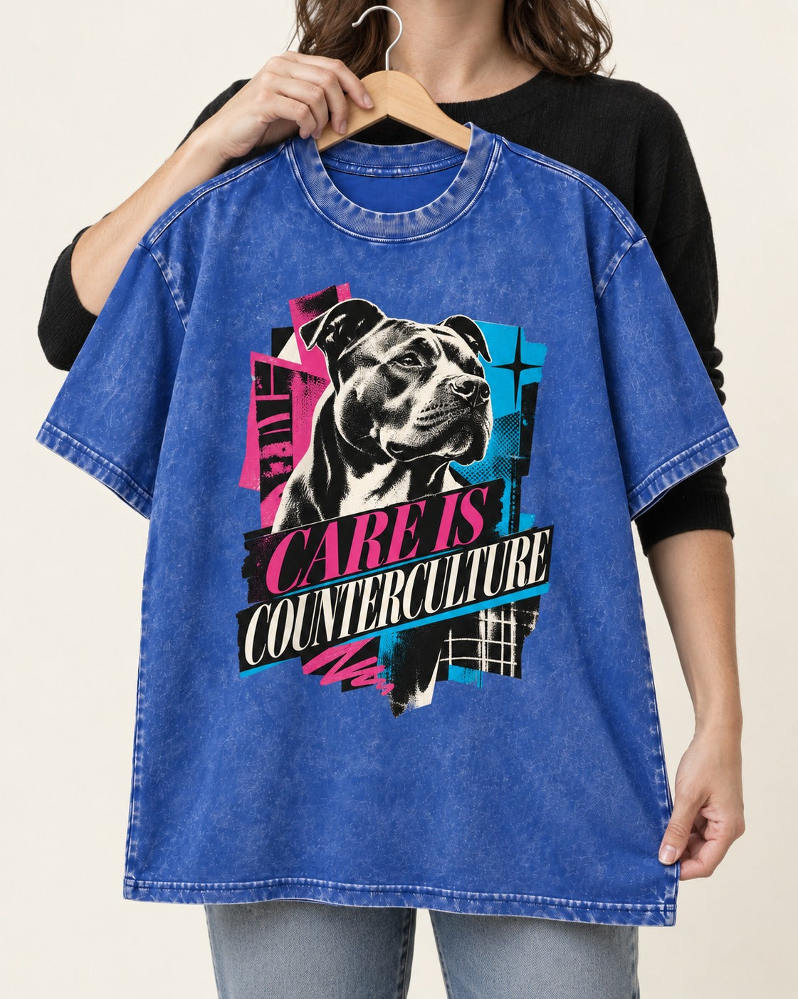 Pitbull Care Is Counterculture Neon Collage Portrait Graphic Washed Tee in Royal Blue, held up on a hanger
