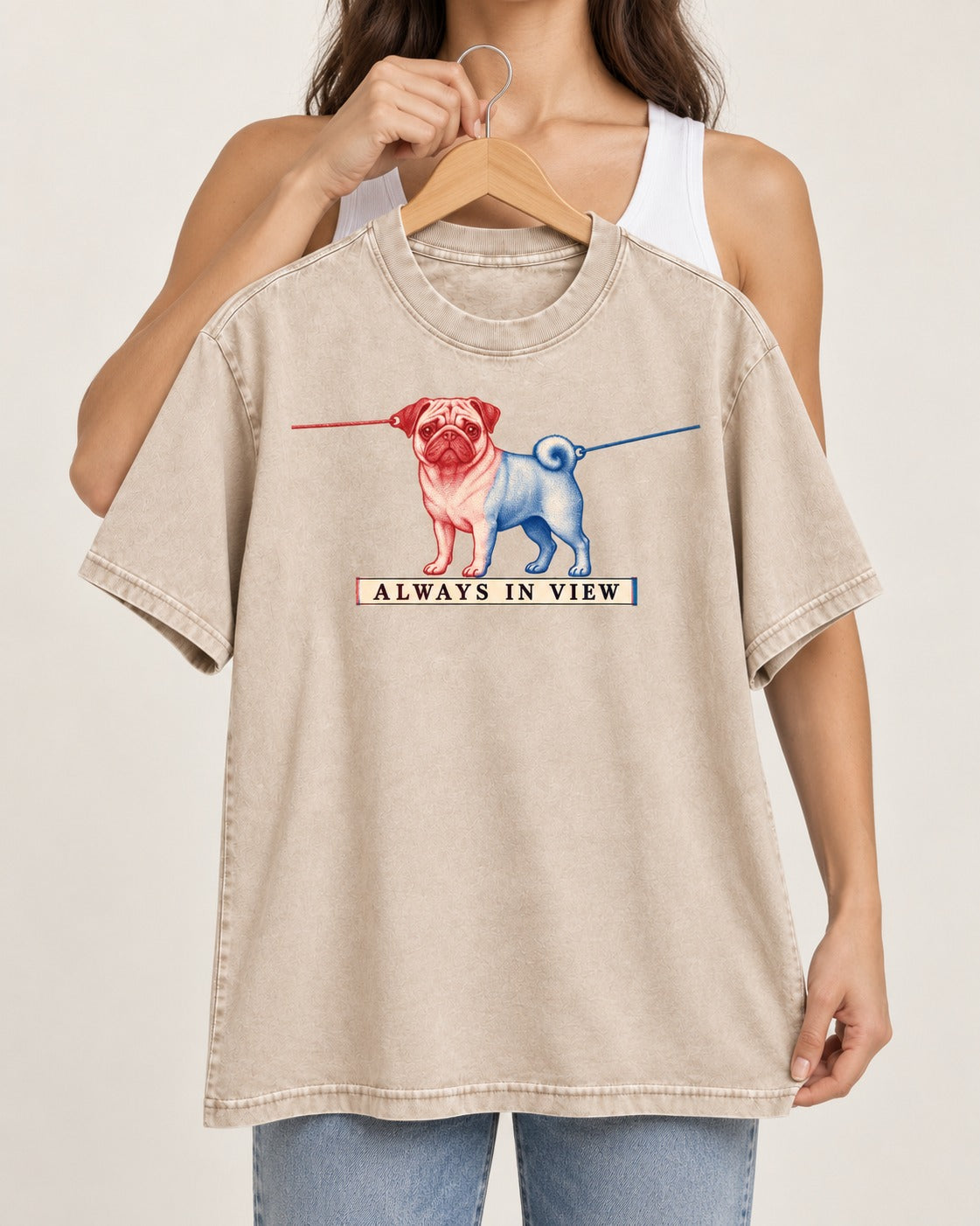 Pug Always in View Split Leash Graphic Washed Tee in Apricot, held up on a hanger