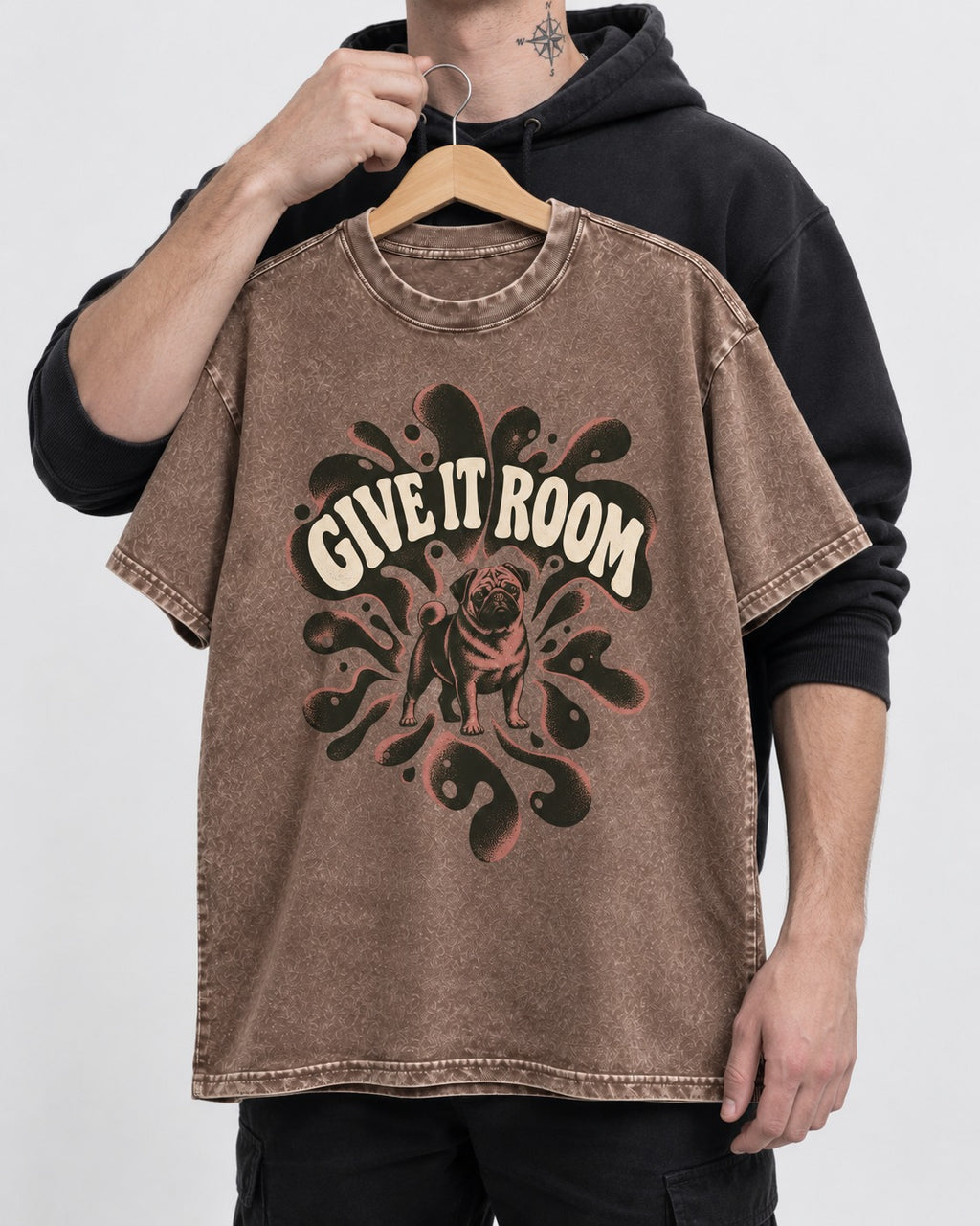 Give Pug Room Washed Tee in Coffee, held up on a hanger