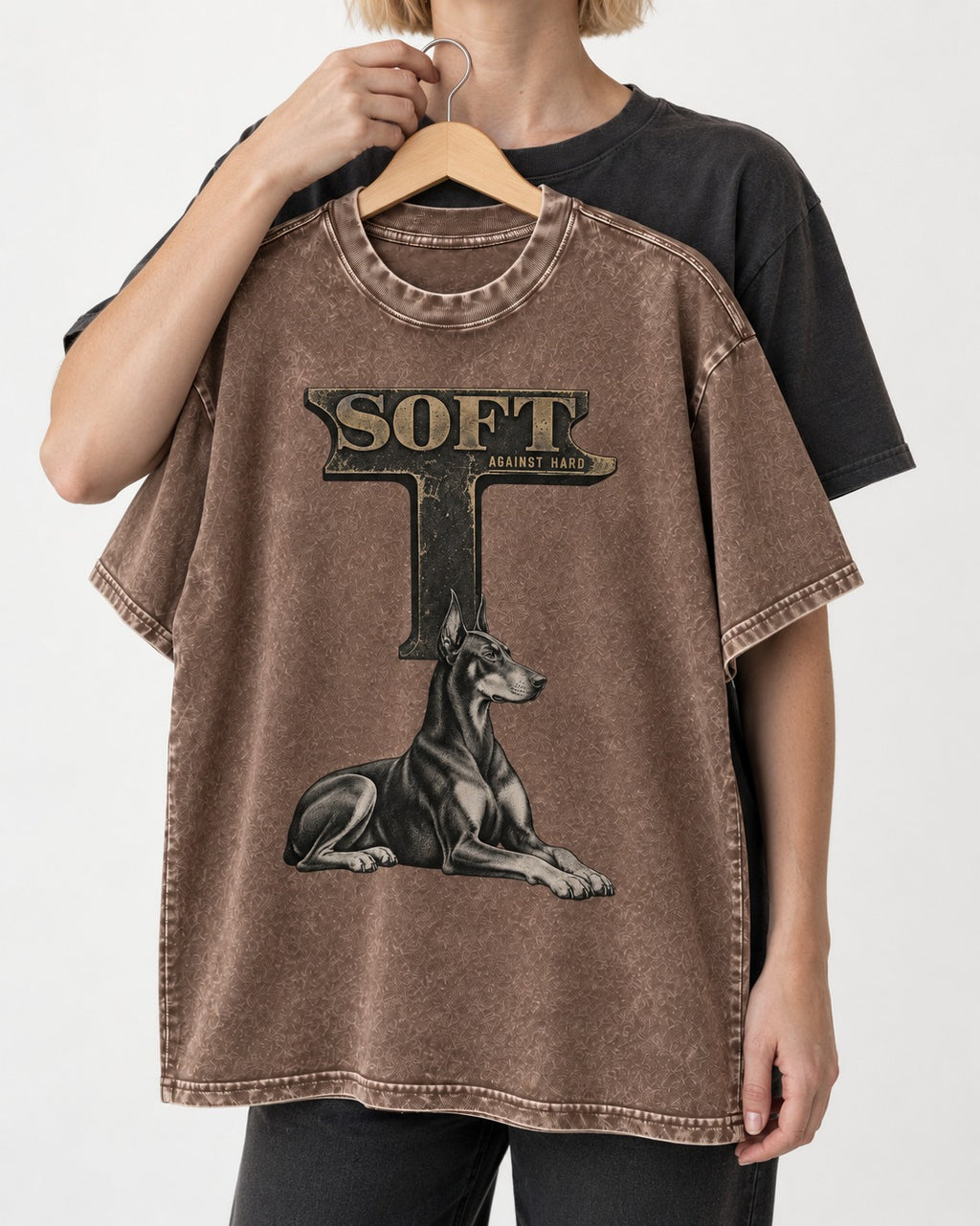 Soft Against Hard Doberman Washed Tee in Coffee, held up on a hanger