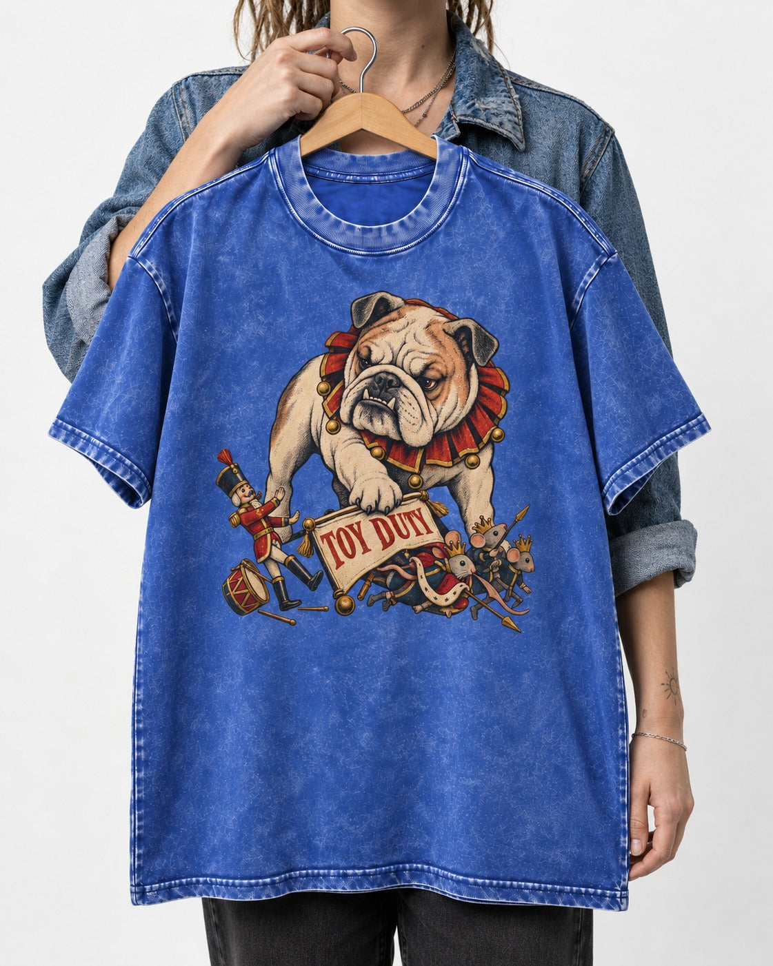 English Bulldog Toy Duty Nutcracker Mice Washed Tee in Royal Blue, held up on a hanger