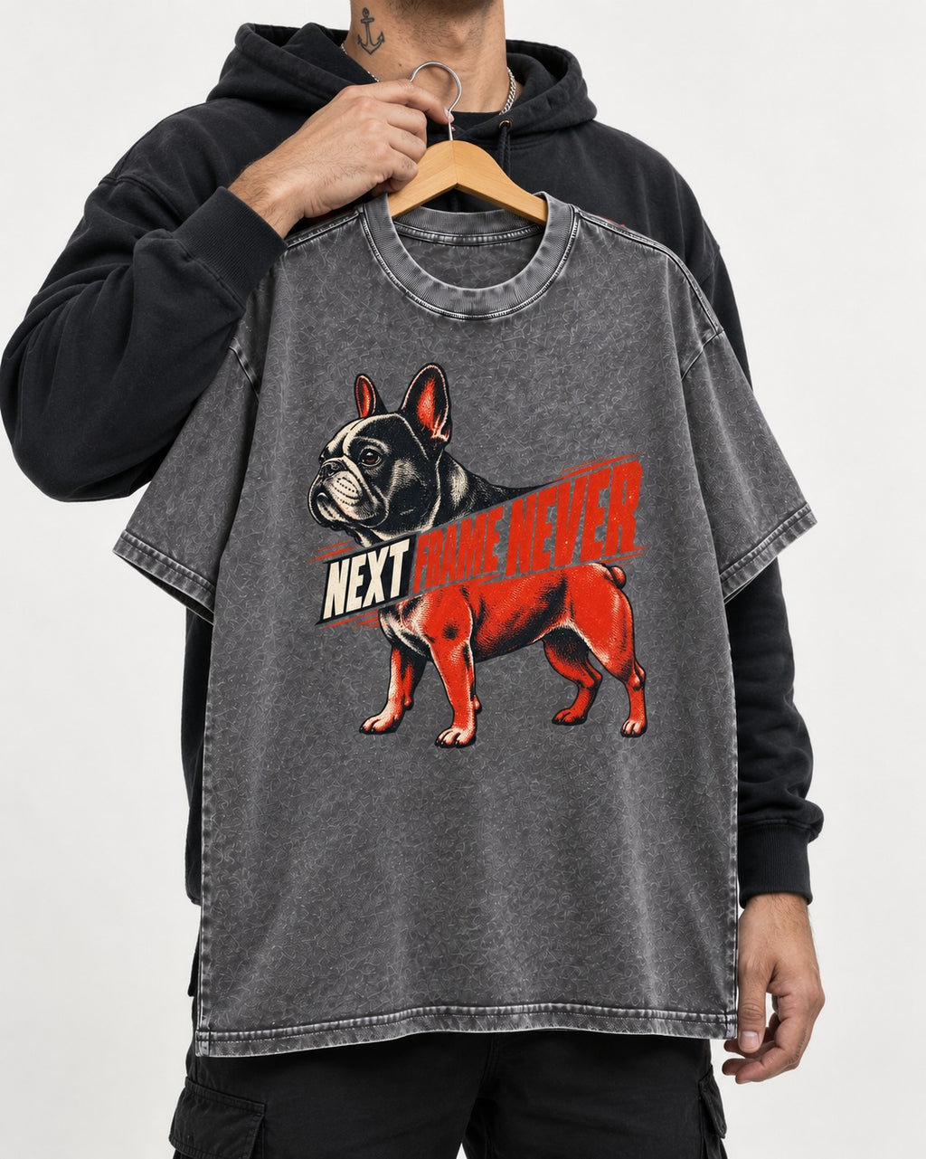 Frenchie Next Frame Never Motion Banner Graphic Washed Tee in Gray, held up on a hanger