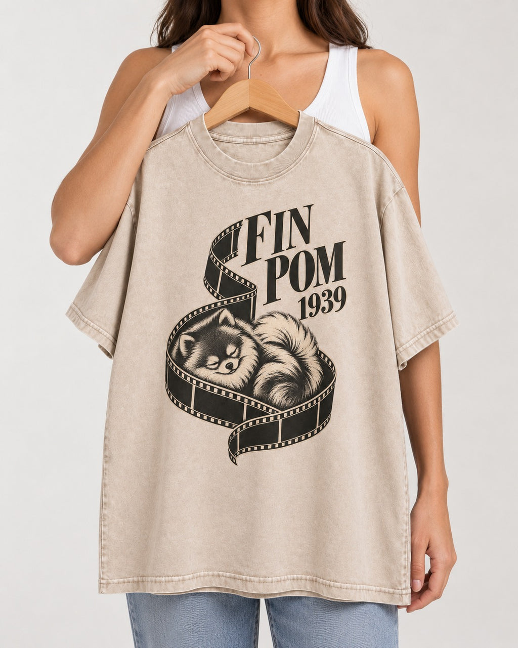 Fin Pomeranian Washed Tee in Apricot, held up on a hanger