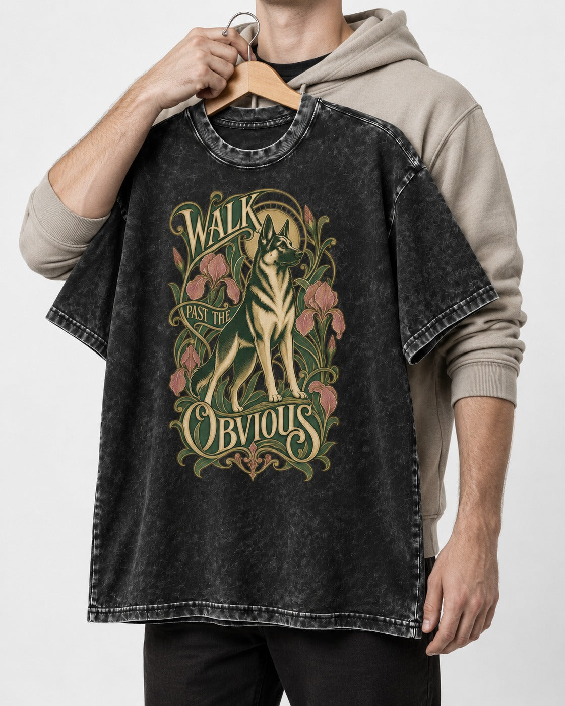 Walk Past The Obvious Art Nouveau German Shepherd Dog Graphic Washed Tee in Black, held up on a hanger