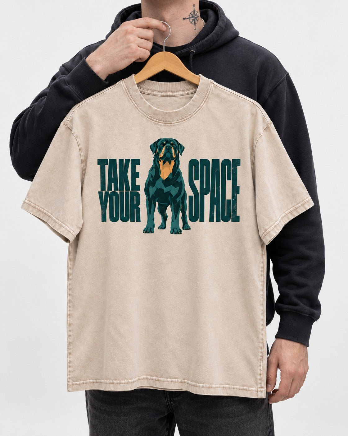 Rottweiler Take Your Space Washed Tee in Apricot, held up on a hanger