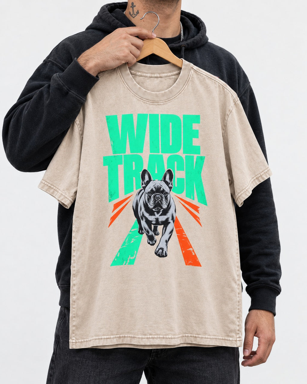 Wide Track Frenchie Washed Tee in Apricot, held up on a hanger
