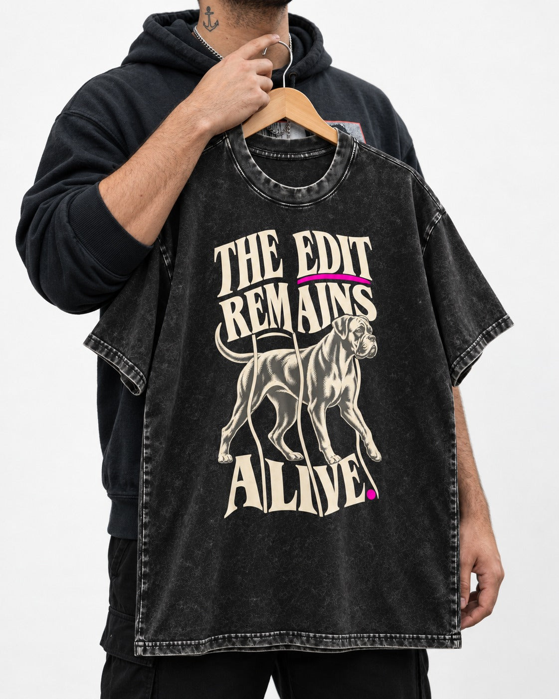The Edit Remains Alive Boxer Washed Tee in Black, held up on a hanger