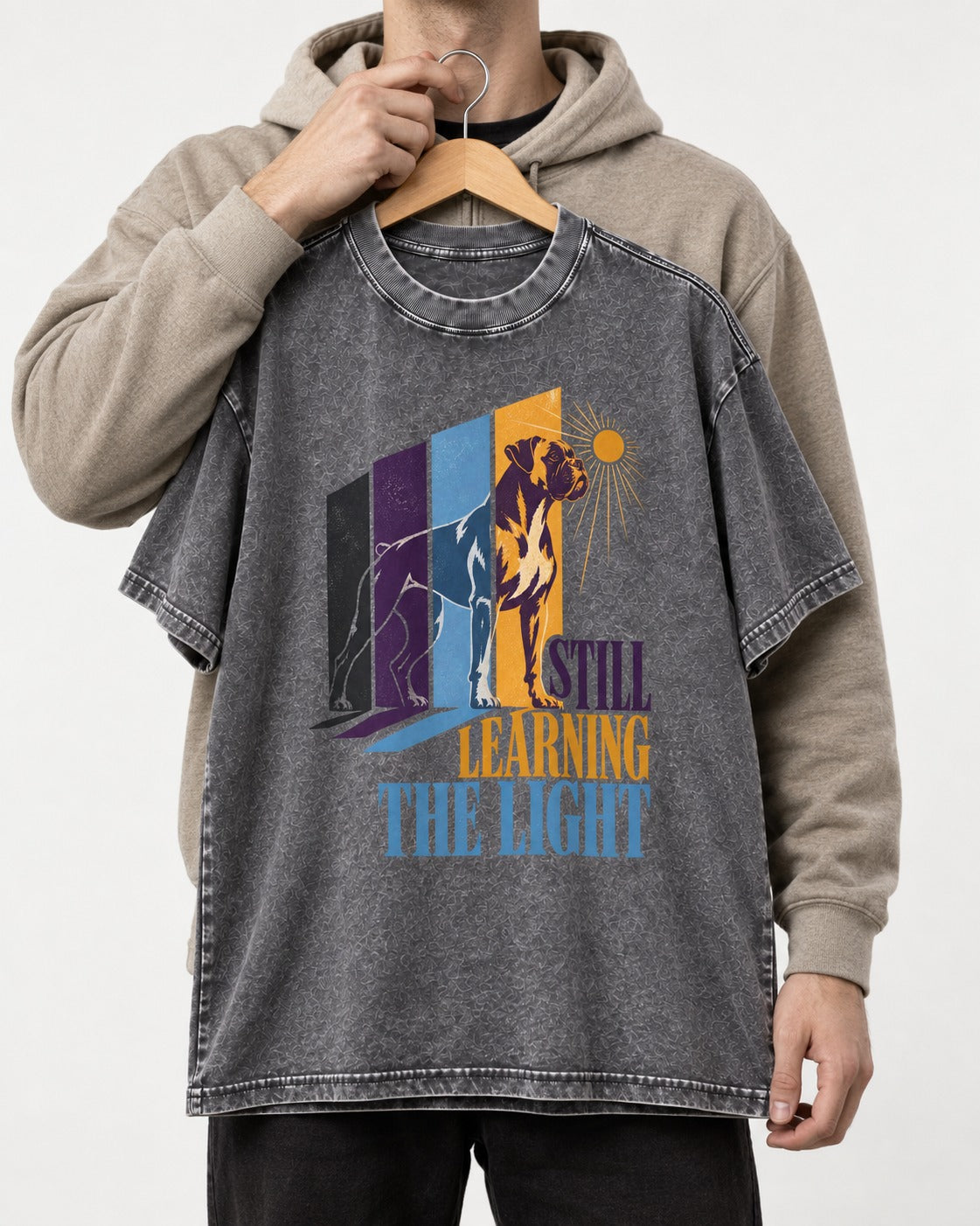 Still Learning the Light Boxer Doorway Progression Graphic Washed Tee in Gray, held up on a hanger