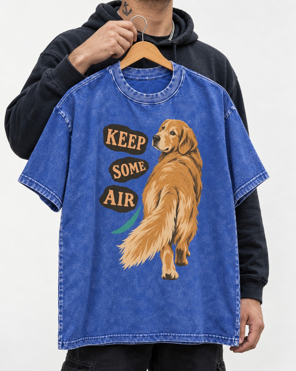 Golden Retriever Keep Some Air Looking Back Graphic Washed Tee in Royal Blue, held up on a hanger