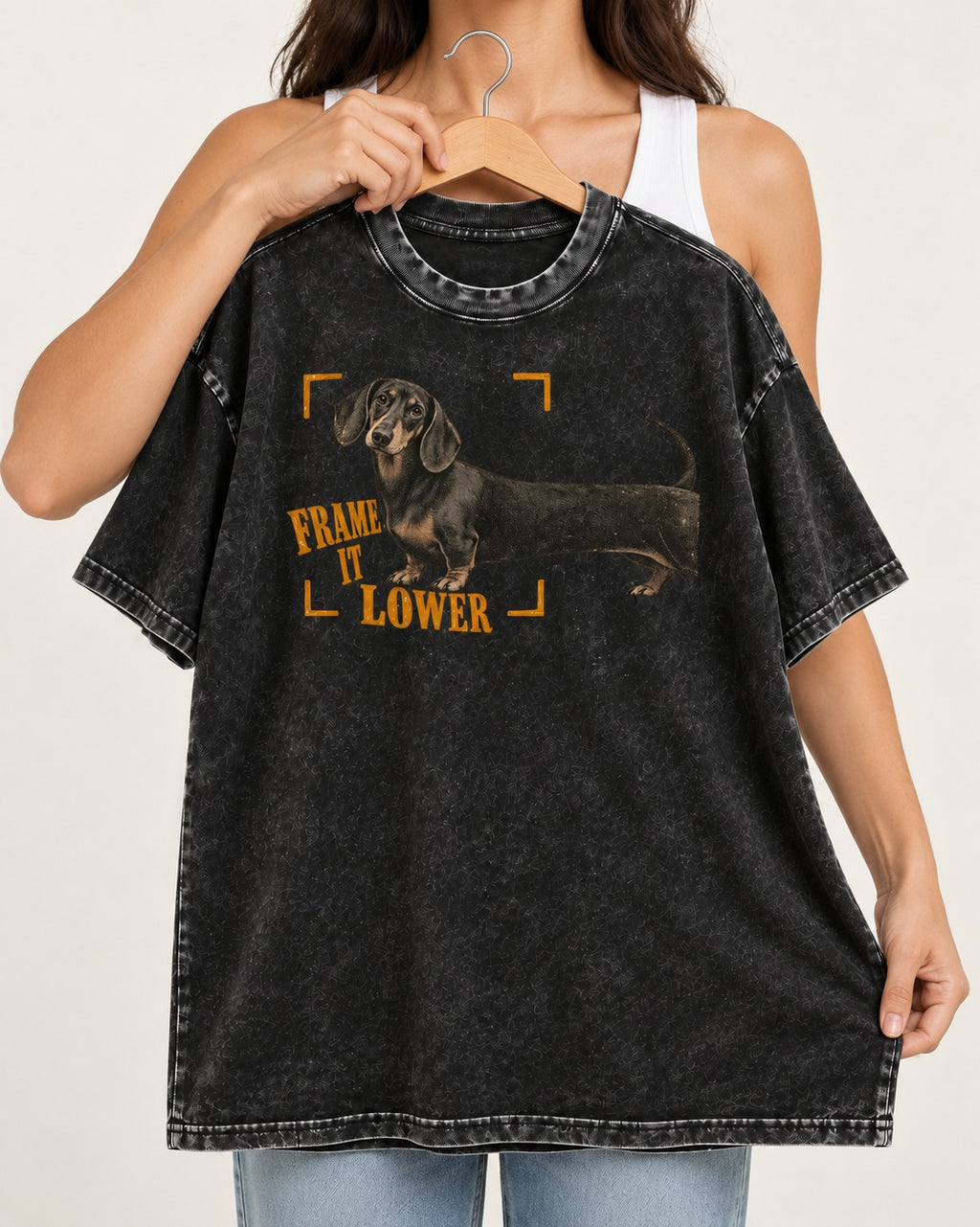 Dachshund Frame It Lower Viewfinder Graphic Washed Tee in Black, held up on a hanger