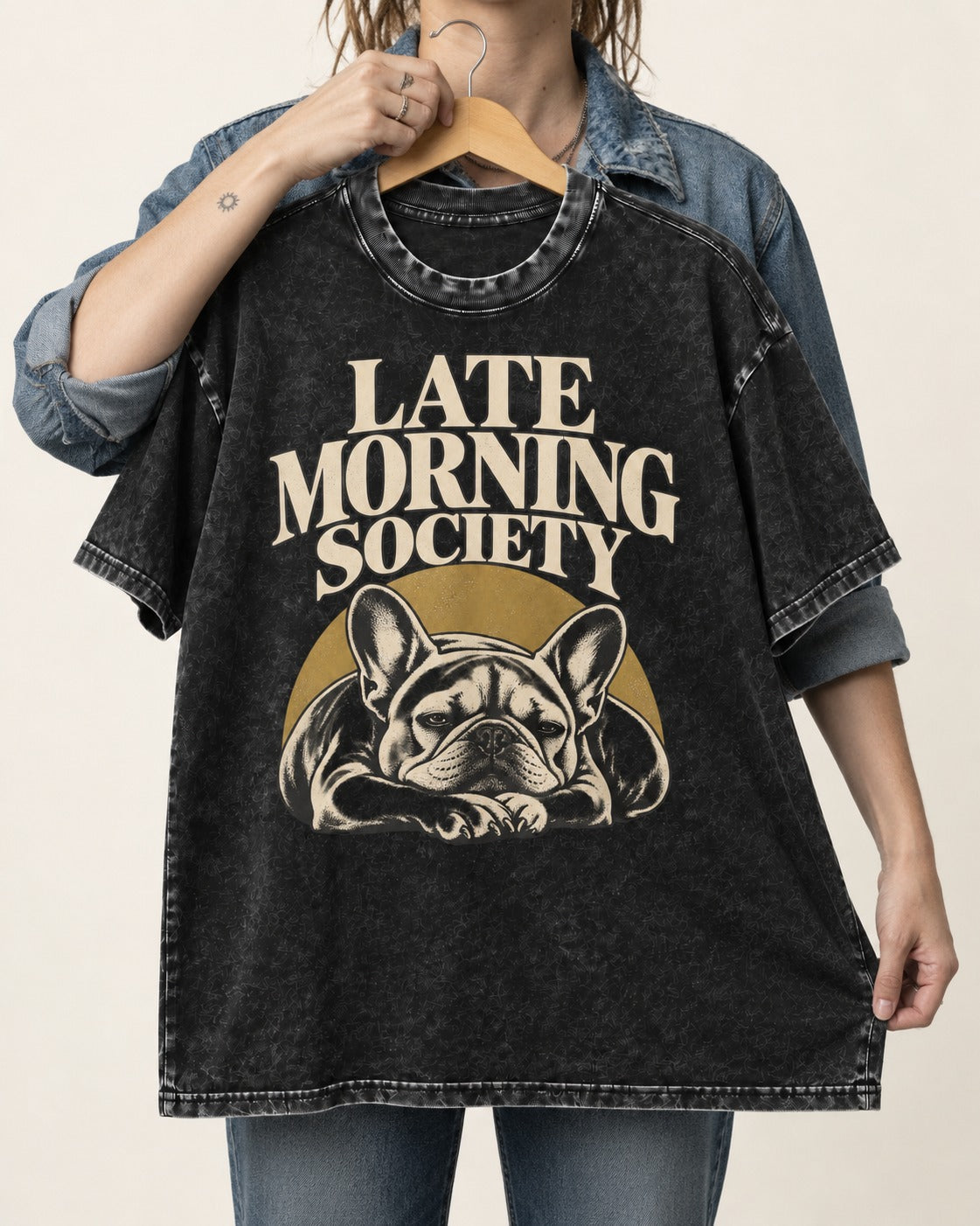 Frenchie Late Morning Society Graphic Washed Tee in Black, held up on a hanger