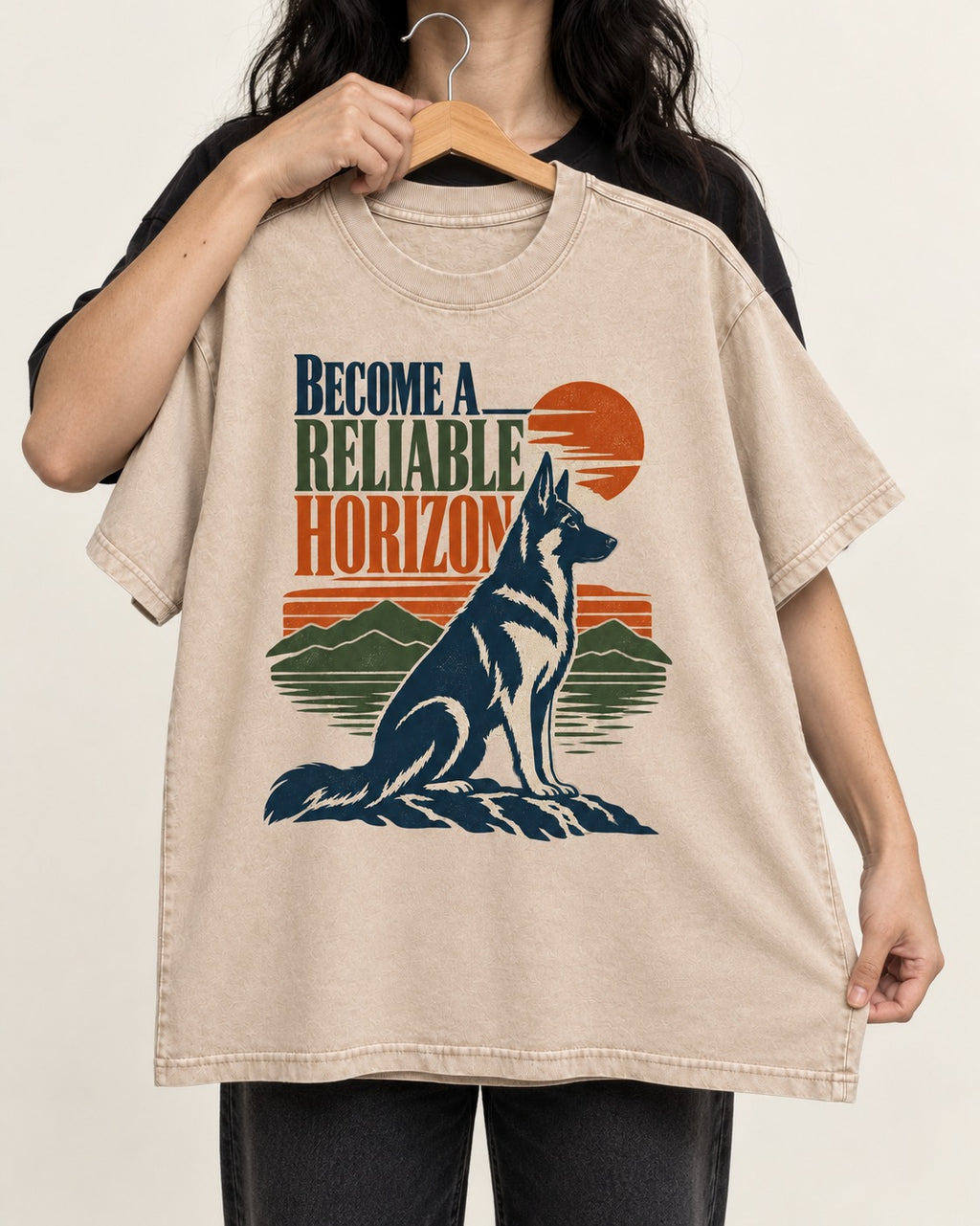 German Shepherd Dog Become a Reliable Horizon Washed Tee in Apricot, held up on a hanger