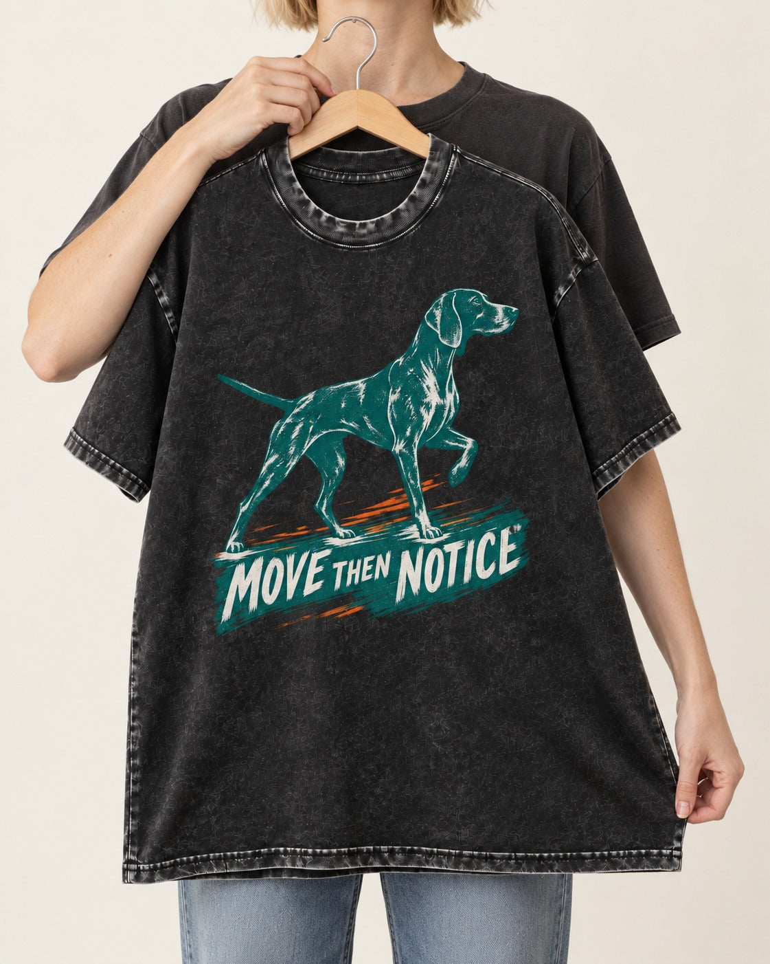 German Shorthaired Pointer Move Then Notice Brushstroke Graphic Washed Tee in Black, held up on a hanger