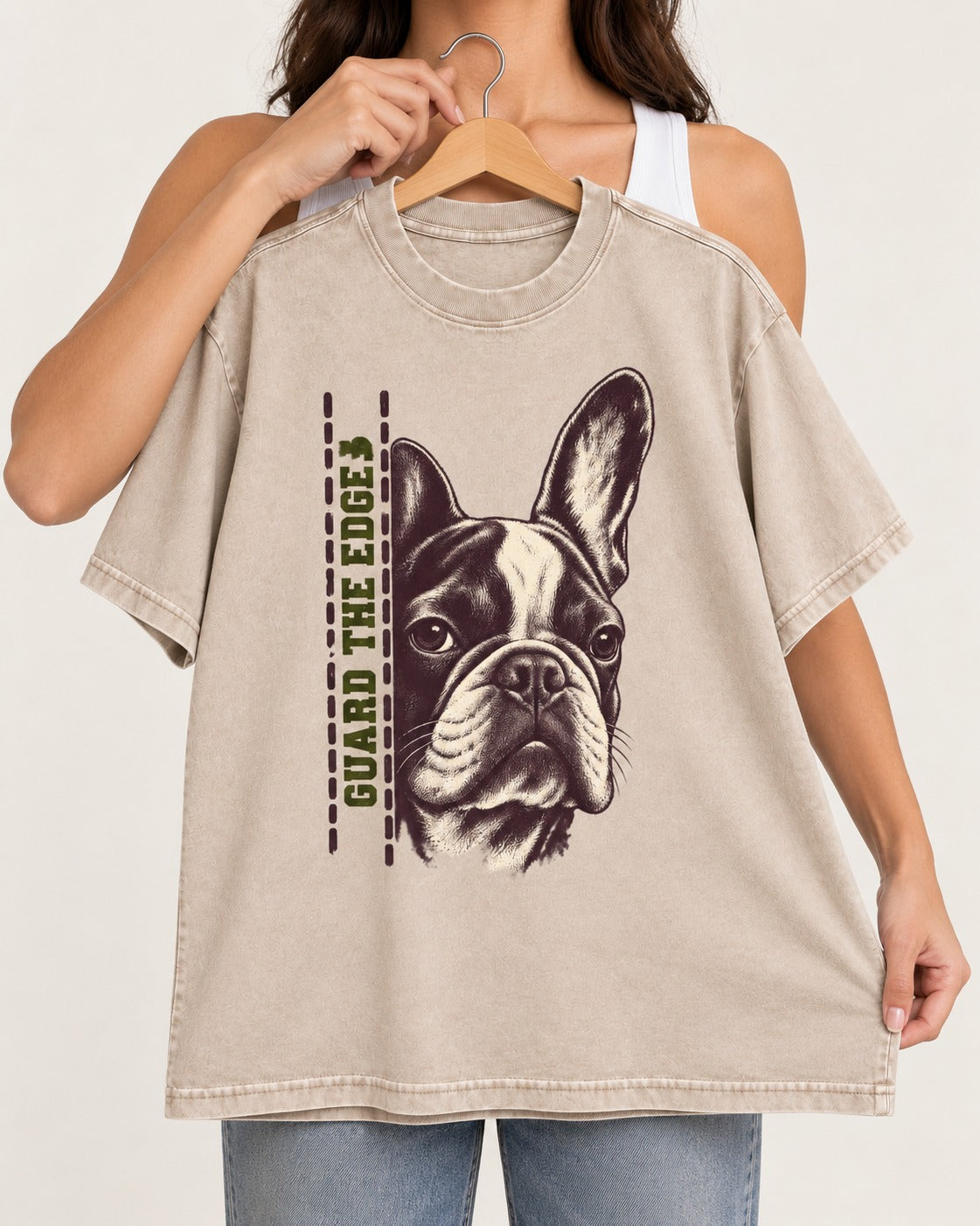 Frenchie Guard the Edge Washed Tee in Apricot, held up on a hanger