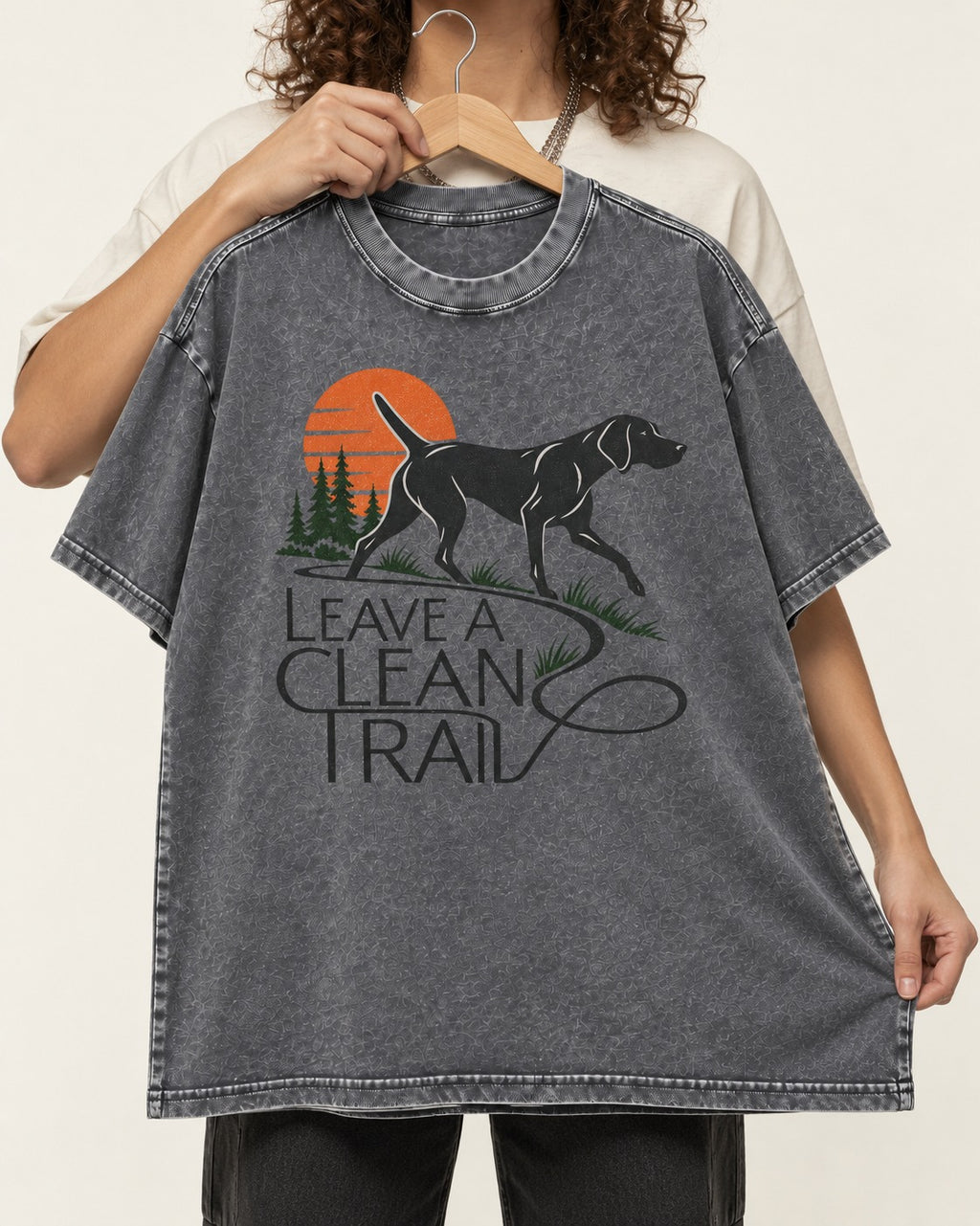 Leave a Clean Trail German Shorthaired Pointer Washed Tee in Gray, held up on a hanger